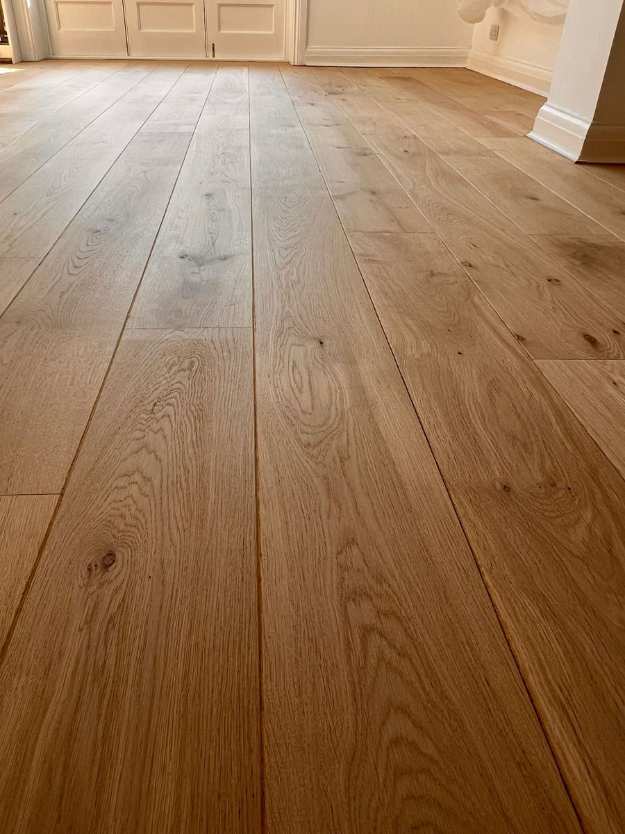 A beautifully restored wooden floor with a natural bare wood effect achieved using Pall-X Pure lacquer in a matte finish.