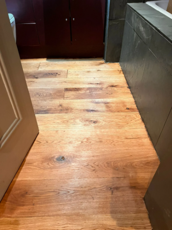 Bathroom oak floor in Highbury restored with sanding and Magic Oil Spa finish for enhanced durability and water resistance.