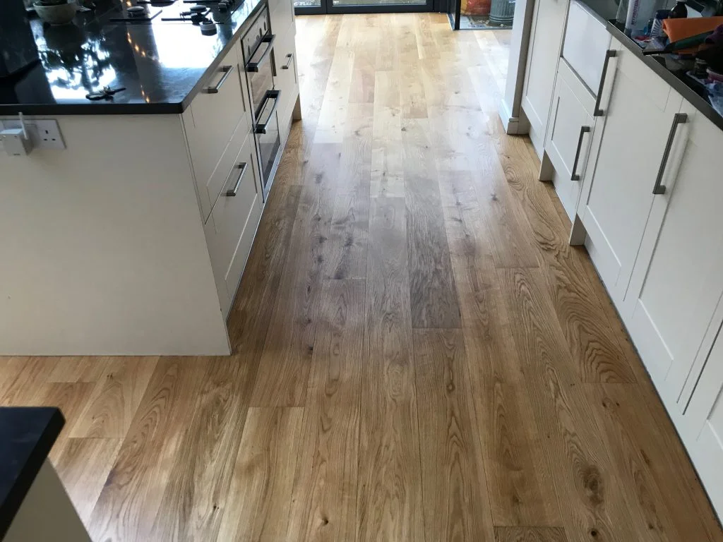 Fully restored oak kitchen floor in Dulwich Village after professional sanding and oiling with Pallmann Magic Oil, showcasing a smooth and even finish.