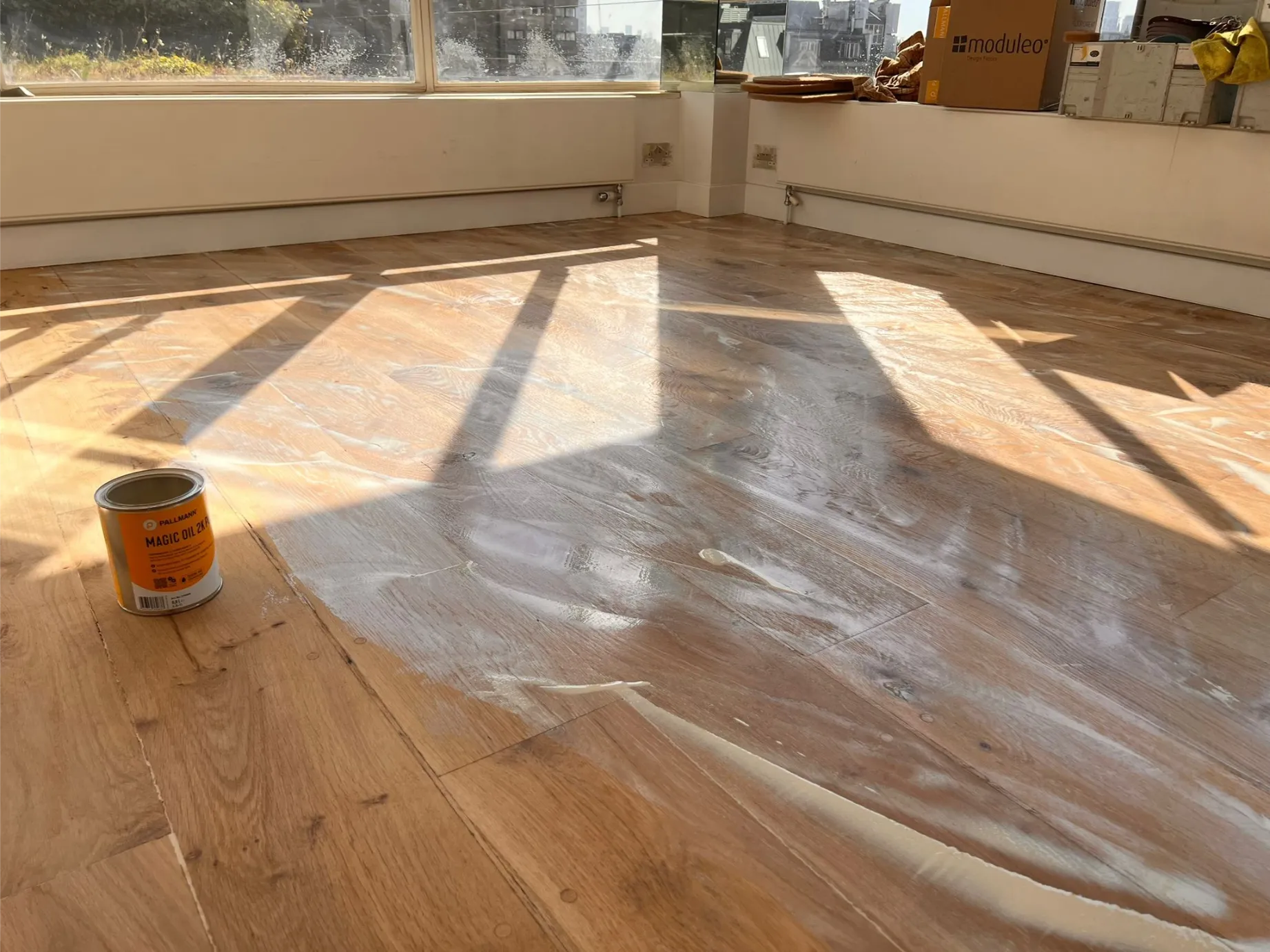 Wooden floor being professionally sanded and oiled with Pallmann Magic Oil Pure in a Soho property.