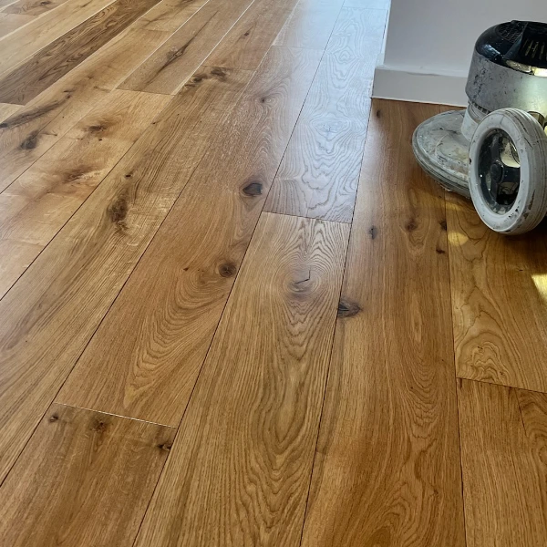 Close-up of an oiled wooden floor, showcasing enhanced grain, natural beauty, and long-term durability.