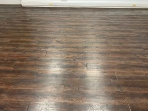 Adhesive removal from laminate flooring