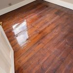 fresh lacquer on sanded and stained floorboards in Tooting