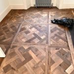 parquet oak wooden floor after first cut with a belt sander